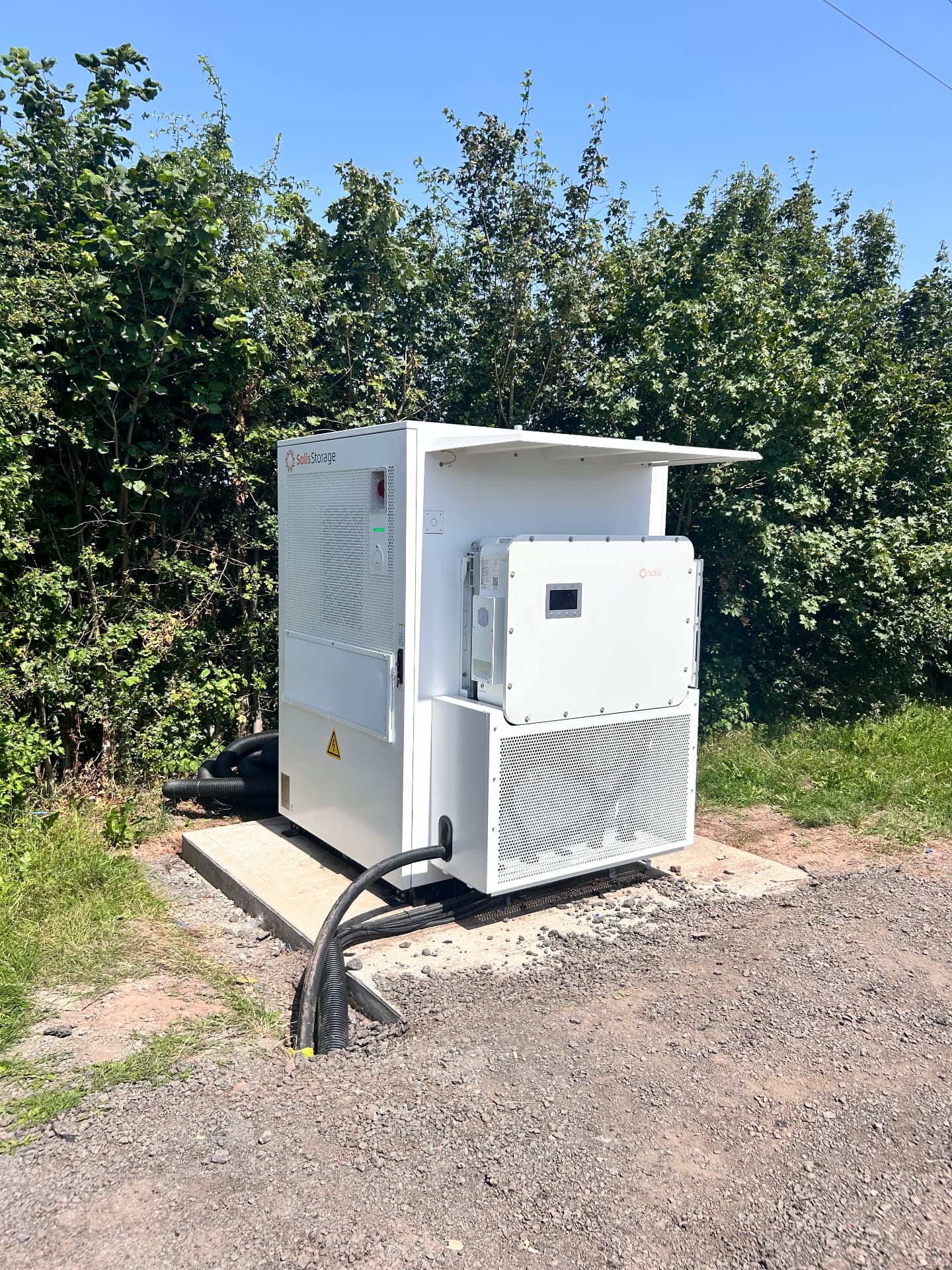 Solis commercial battery storage and inverter cabinets installed on a concrete base by Solar Pro Solutions